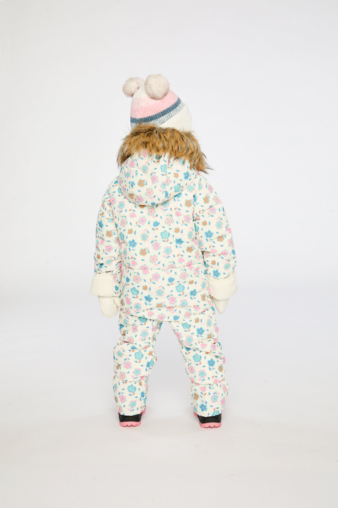 Baby girl in white floral Deux par Deux Snug snowsuit with fold-over sherpa cuffs