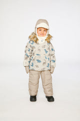 Baby boy wearing Deux par Deux Blue Dinosaur Baby Snug snowsuit with faux fur hood