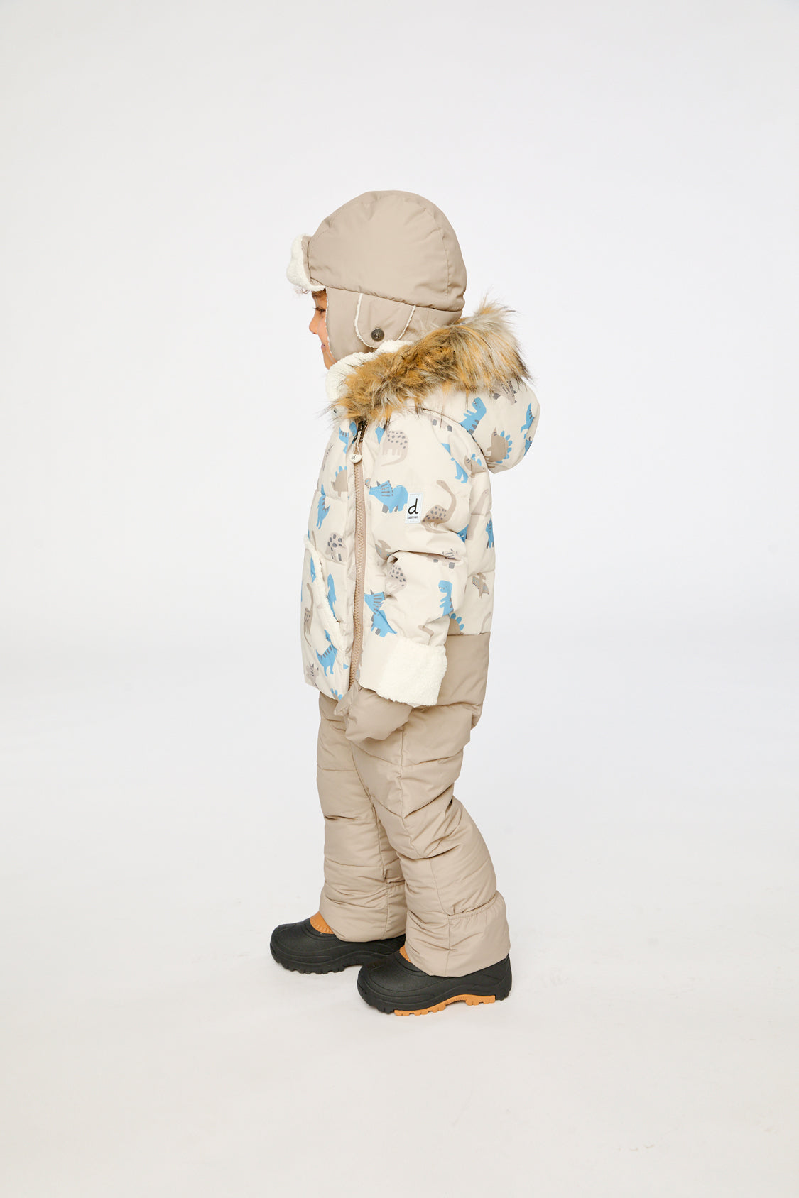 Deux par Deux Blue Dinosaur Baby Snug snowsuit lifestyle view with sherpa-lined hood