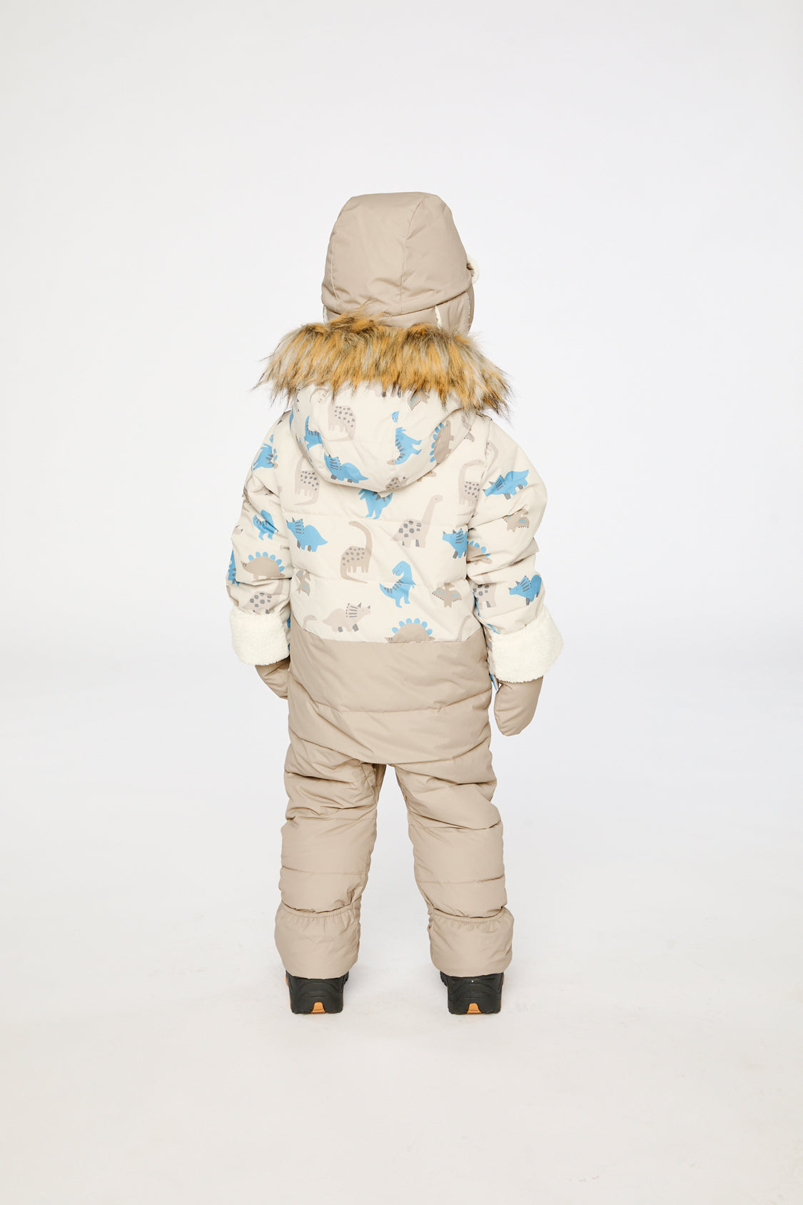 Baby boy in Deux par Deux Blue Dinosaur snowsuit with fold-over sherpa cuffs and ankles