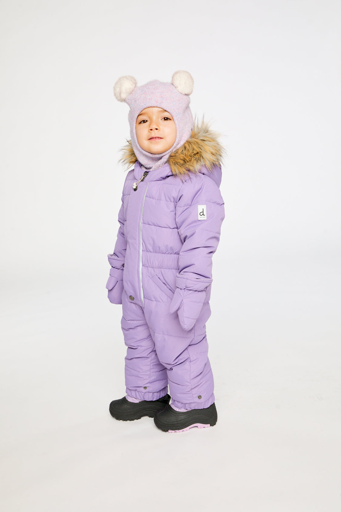 Deux par Deux Baby Original puffy one-piece snowsuit in Violet shown from an alternate modeled winter angle