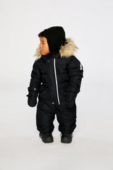 Baby wearing the Deux par Deux Baby Original puffy one-piece snowsuit in Black in a winter lookbook view