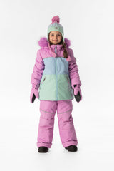 Girl standing in the pinkish violet colour-block Deux par Deux DISCOVER snowsuit, full-length front view