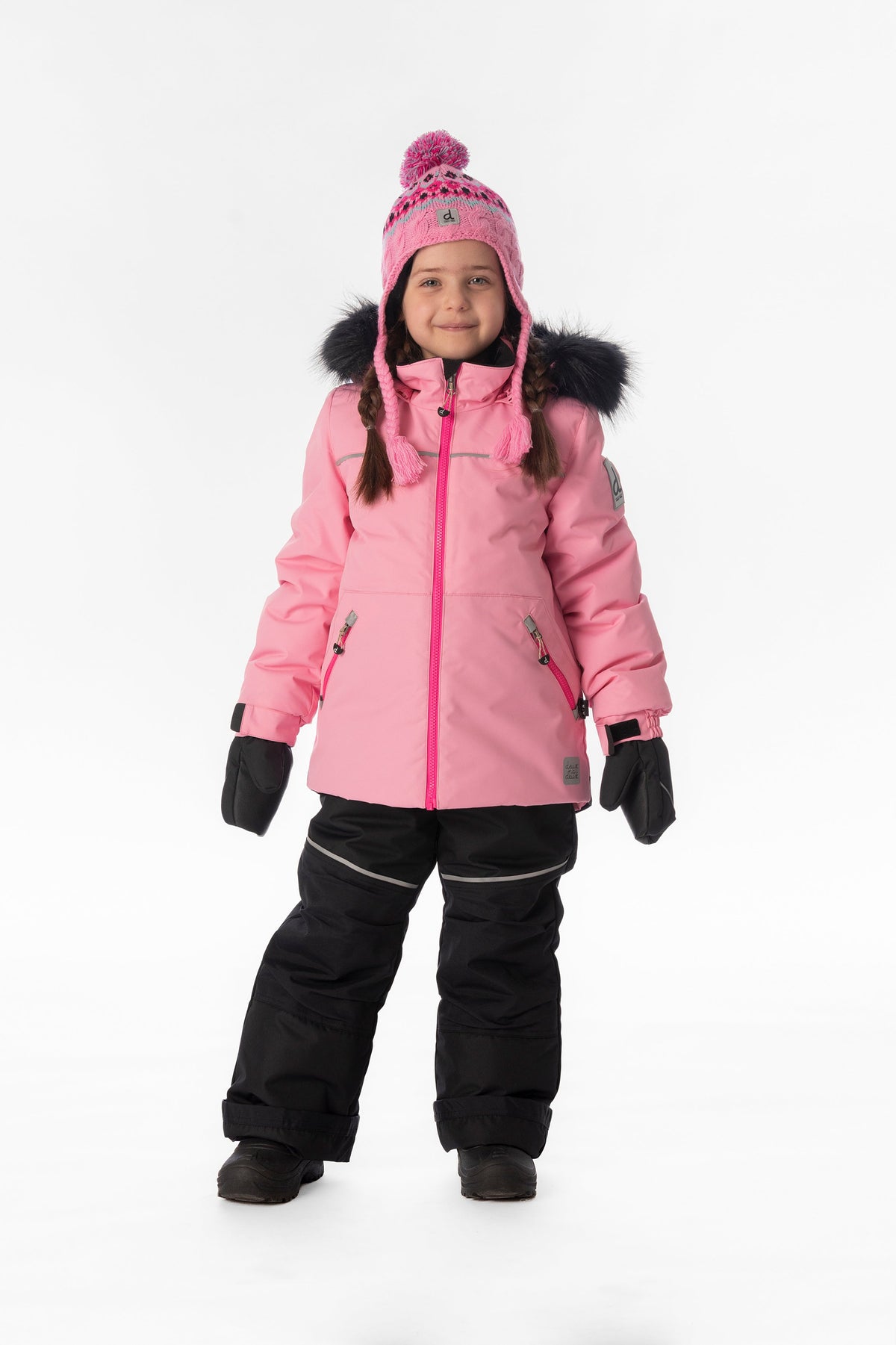 Girl standing in the pink and black Deux par Deux DISCOVER snowsuit, full-length front view