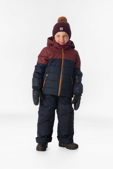 Boy standing in the navy and burgundy Deux par Deux PLAY snowsuit, full-length front view