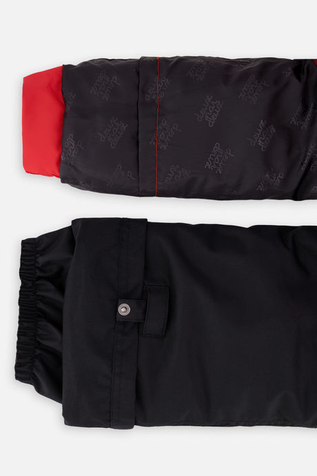 Deux par Deux boys PLAY snowsuit, red and black – sleeve and pant hem extensions for growing room