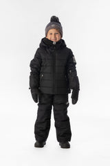 Boy standing in the all-black Deux par Deux PLAY snowsuit, full-length front view