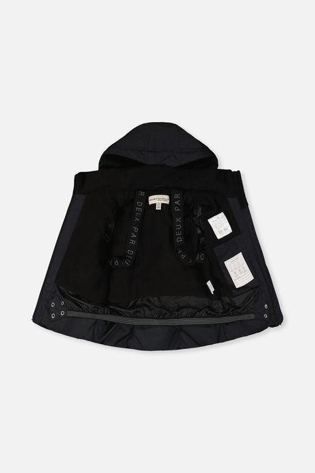Boys black winter jacket interior with snow skirt and backpack straps