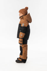 Boy in the brown and black Deux par Deux PLAY snowsuit, side view