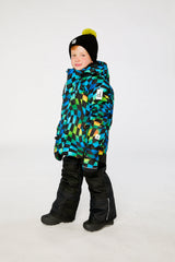 Deux par Deux PLAY checkerboard jacket and black snow pants winter lifestyle view