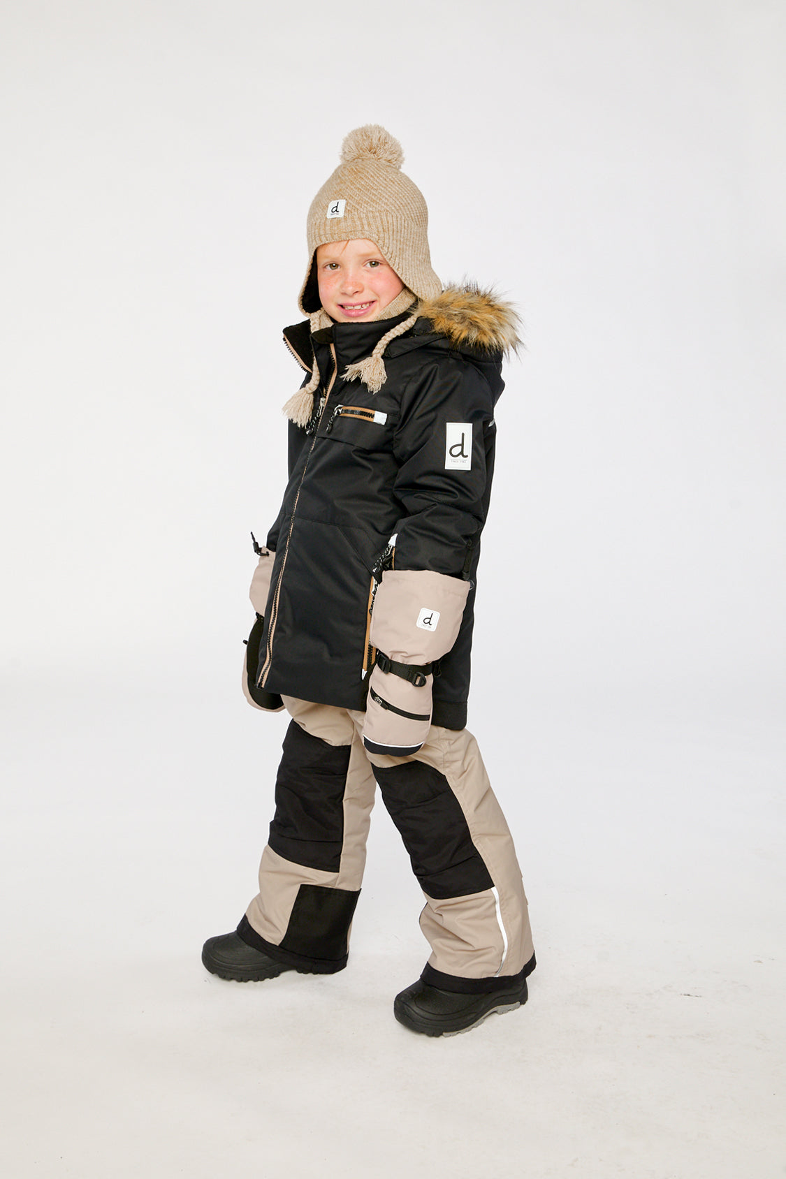 Boys Deux par Deux PLAY snowsuit in black and beige with durable Cordura-reinforced snow pants