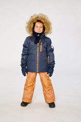 Deux par Deux PLAY two-piece snowsuit in Navy Blue with Brown Pants shown from an alternate modeled winter angle