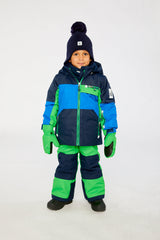 Child wearing the Deux par Deux PLAY two-piece snowsuit in Royal Blue and Green Colorblock in a winter lookbook view