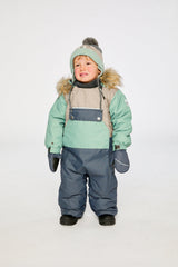 Baby wearing the Deux par Deux baby car-seat one-piece snowsuit in Cool Dark Grey in a winter lookbook view