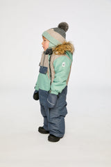 Deux par Deux baby car-seat one-piece snowsuit in Cool Dark Grey shown from an alternate modeled winter angle