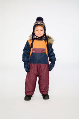 Baby wearing the Deux par Deux baby car-seat one-piece snowsuit in Burgundy in a winter lookbook view