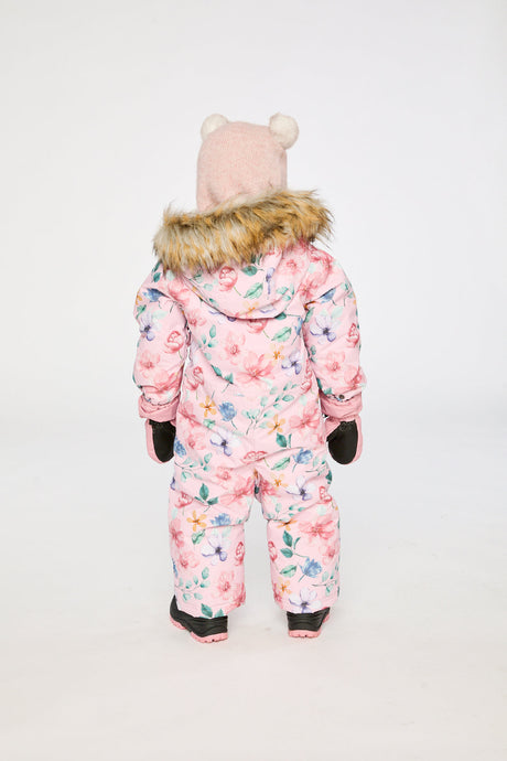 Back view of a toddler girl in the pink floral print snowsuit with faux-fur trimmed hood