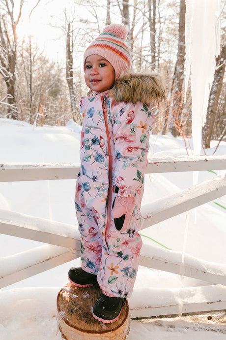 Baby girl wearing Deux par Deux pink floral one-piece winter snowsuit for car seat outings