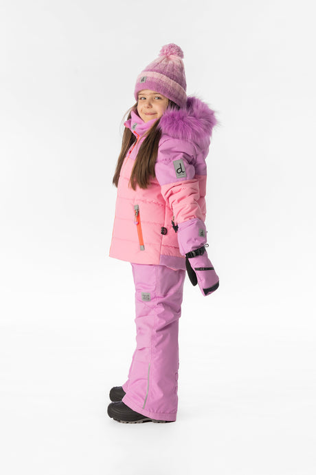 Girl in the pinkish violet and pink Deux par Deux PLAY snowsuit, side view