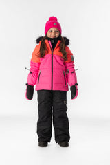 Girl standing in the coral, bright pink and black Deux par Deux PLAY snowsuit, full-length front view