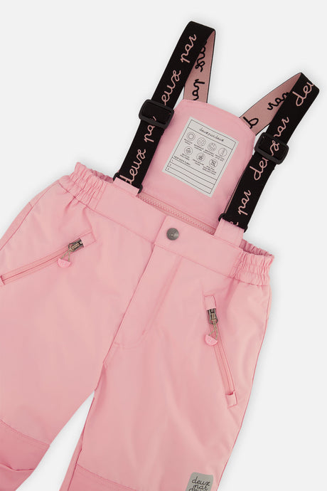 Close-up of the pink snow pants waist, zip pockets and Deux par Deux suspenders