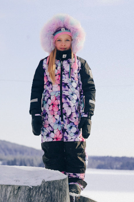 Girls Deux par Deux purple floral PLAY snowsuit shown as a streamlined one-piece winter suit.