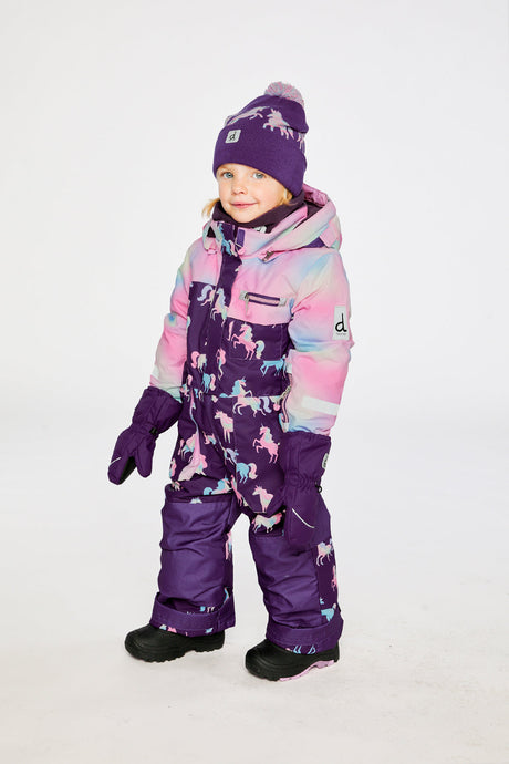Deux par Deux kids PLAY one-piece snowsuit in Purple Unicorn Print shown from an alternate modeled winter angle