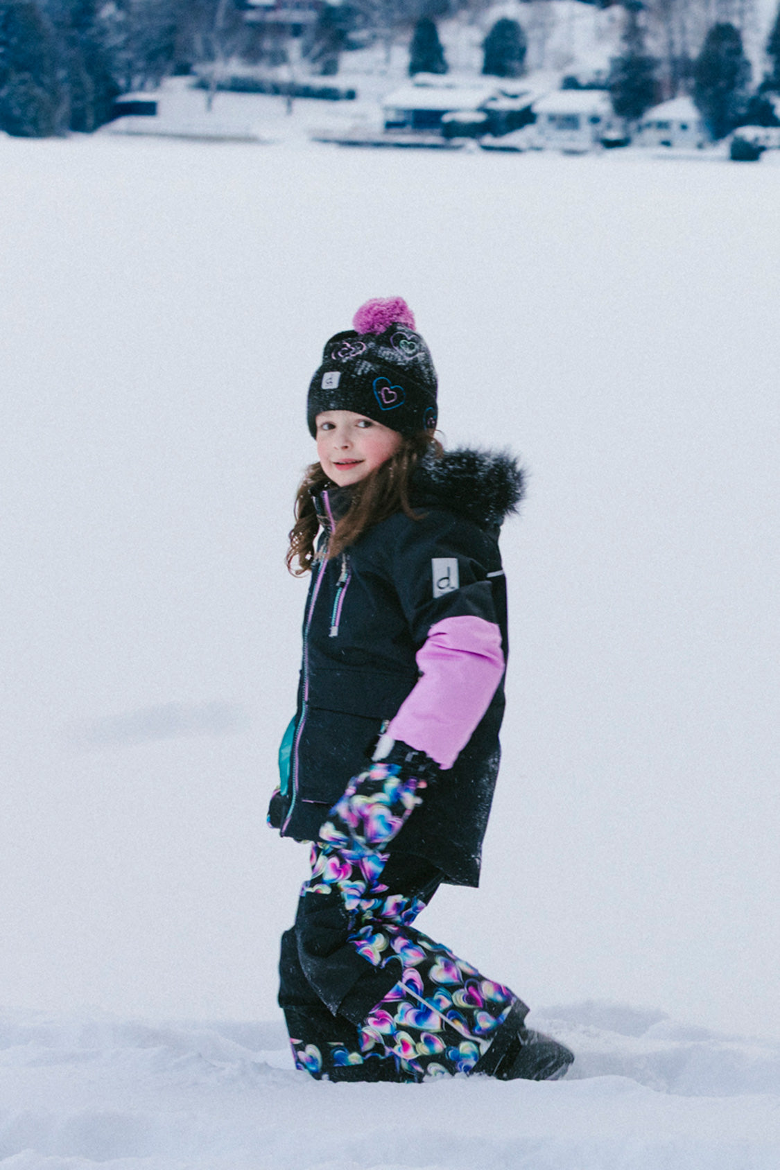 Girls Deux par Deux PLAY snowsuit in black blue and pink with playful heart-print winter pants