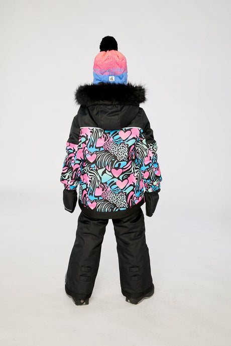 Girl in Deux par Deux -30°C black zebra snowsuit for skiing and winter snow play
