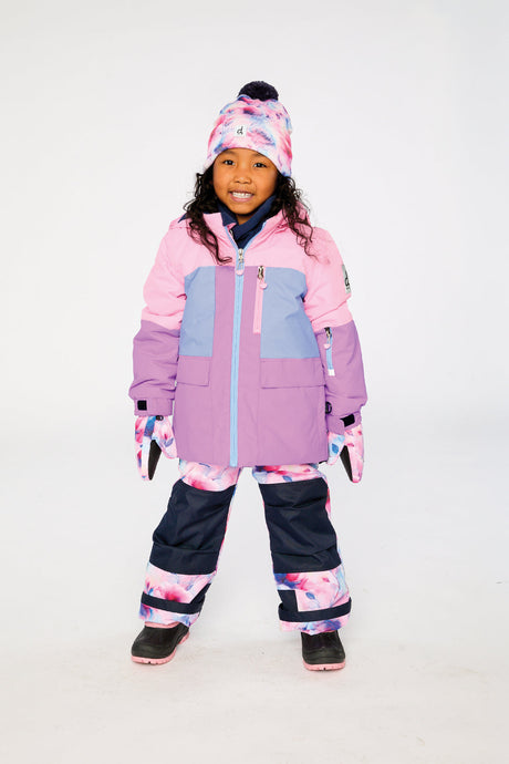 Girl wearing Deux par Deux pink purple PLAY snowsuit with watercolor floral snow pants