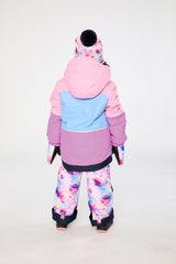 Girl in Deux par Deux PLAY snowsuit with pink purple jacket and floral reinforced snow pants