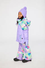 Side view of a child wearing the lavender and multicolor diamond-print snowsuit with a patterned hood