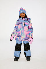 Child wearing the Deux par Deux PLAY two-piece snowsuit in Pink Mountain Print with Blue Pants in a winter lookbook view