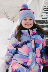 Deux par Deux PLAY two-piece snowsuit in Pink Mountain Print with Blue Pants shown in an alternate outdoor winter lifestyle view