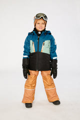 Child wearing the Deux par Deux TEKNIK two-piece snowsuit in Navy Blue in a winter lookbook view