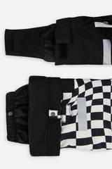 Close-up of the TEKNIK jacket cuff and the adjustable snow pant hem with snap tab
