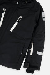 Close-up of the chest zip pockets and sleeve on the black TEKNIK jacket