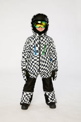Child wearing the Deux par Deux TEKNIK two-piece snowsuit in White Checkered Print in a winter lookbook view