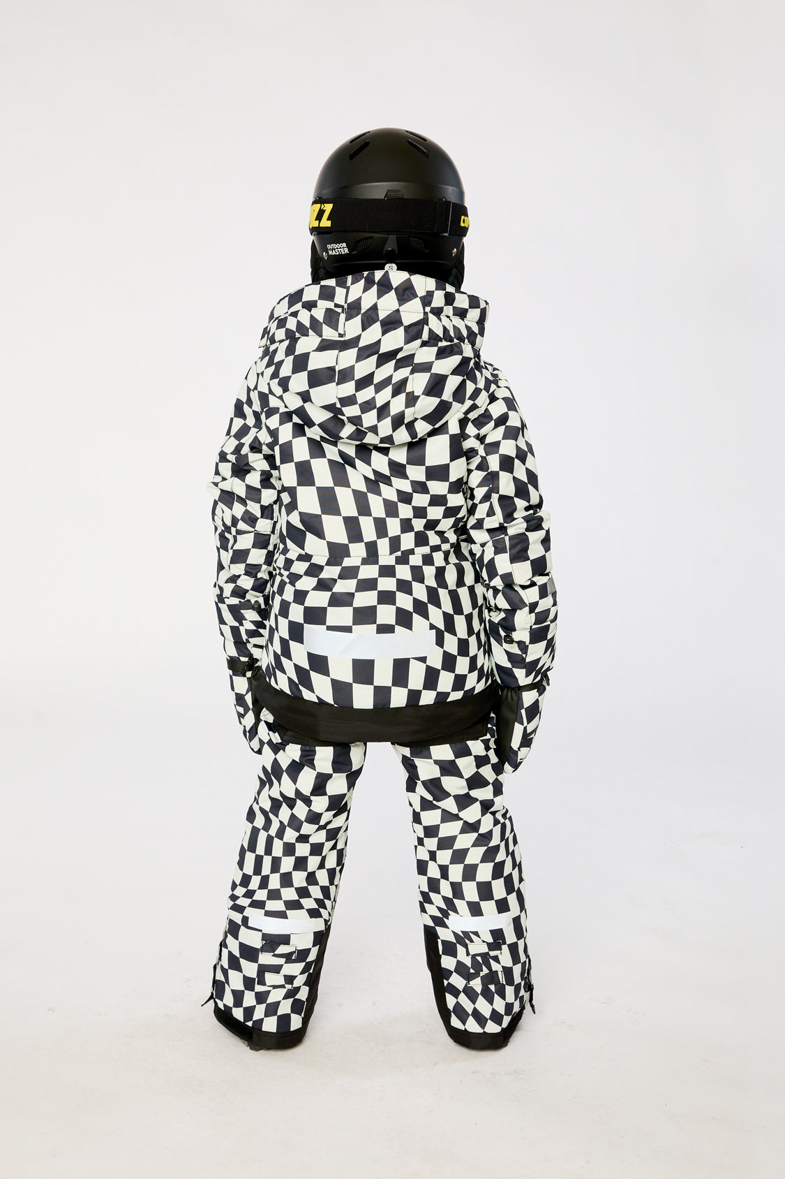 Alternate winter lookbook view of the Deux par Deux TEKNIK two-piece snowsuit in White Checkered Print