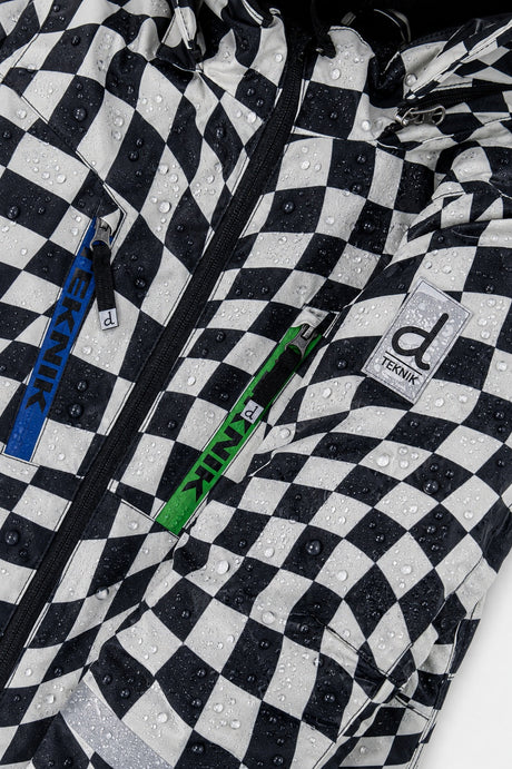 Close-up of the checkered print, chest zipper and logo on the TEKNIK jacket