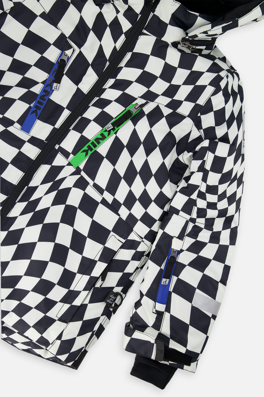 Close-up of the checkered jacket with blue and green zipper pulls