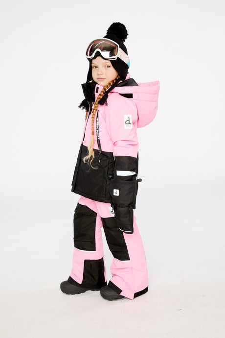 Kids pink TEKNIK snowsuit by Deux par Deux shown in an alternate winter lookbook view