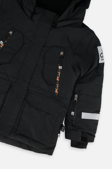 Deux par Deux girls' Teknik two-piece snowsuit, black jacket with leopard print pants – jacket detail close-up