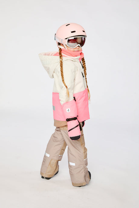 Deux par Deux TEKNIK two-piece snowsuit in Off-White and Pink shown from an alternate modeled winter angle