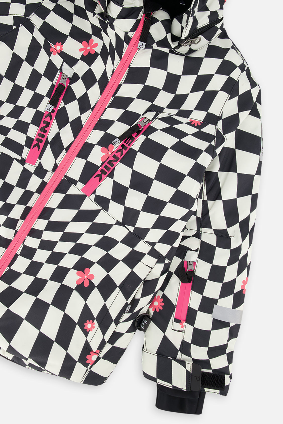 Close-up of the chest zip pockets and sleeve on the checkered TEKNIK jacket