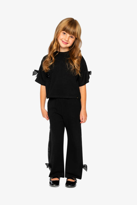Full view of the Deux par Deux black flare-leg milano pants