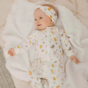 Petit Lem baby girl Golden Pebble Terrazzo footed sleeper – alternate view