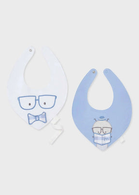 Two blue and white baby bibs with glasses and character designs