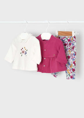 Ivory floral top, berry cardigan and printed leggings hanging together