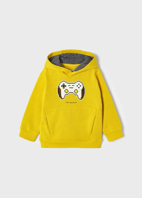 Boy wearing yellow game controller pullover hoodie